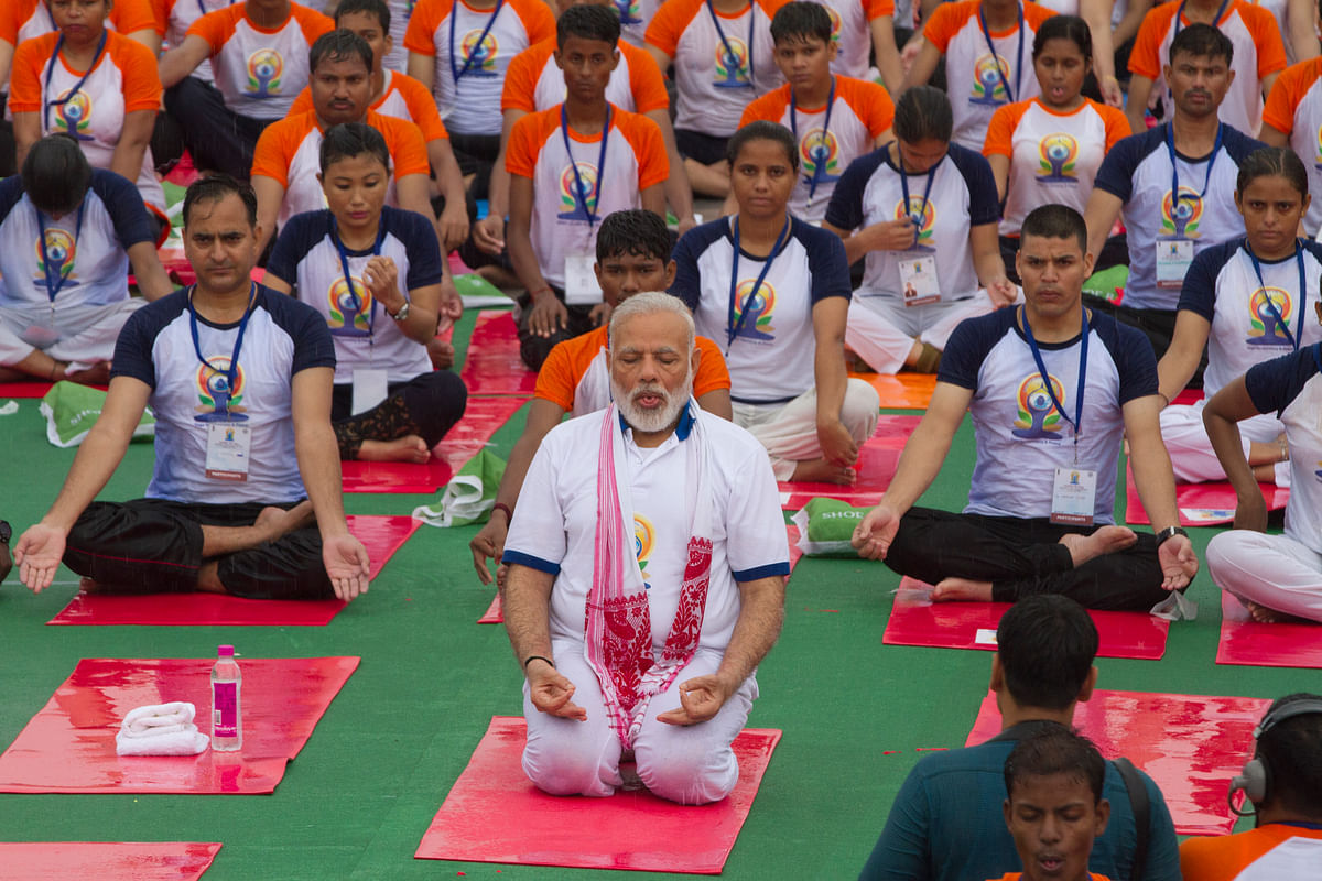 In Pics People Pause, Stretch and Pose for International Yoga Day